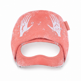 VelaX pink migraine relief cap on white background