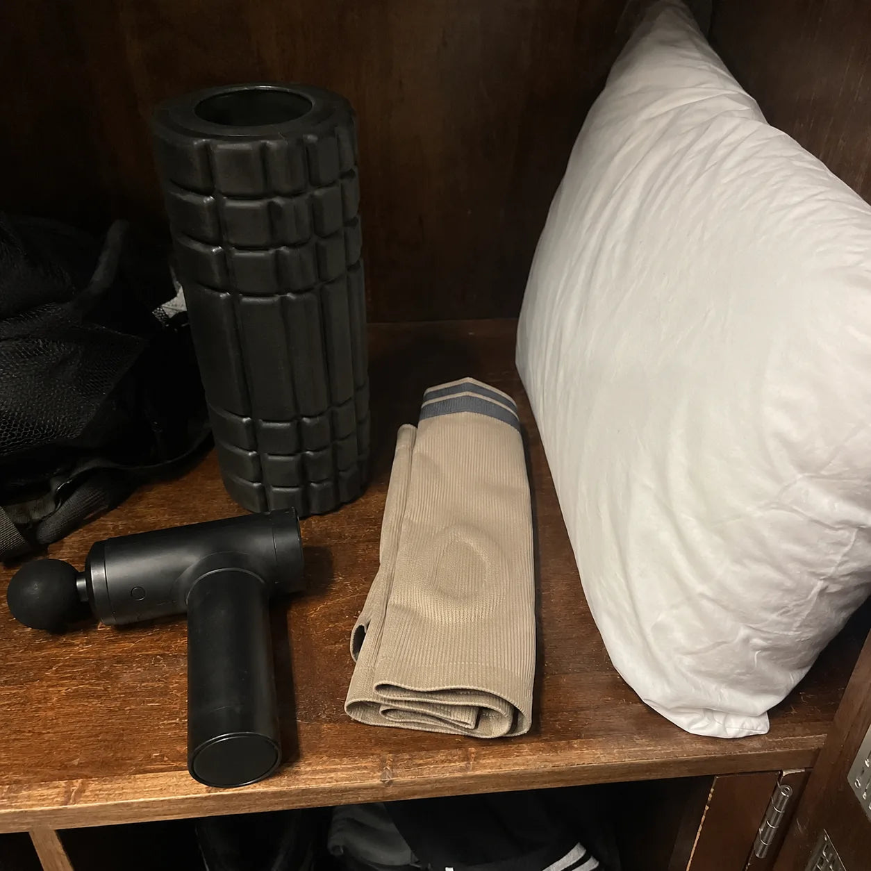 Compression socks, foam roller and massage gun